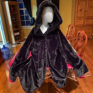 This is a faux fur hooded women’s coat